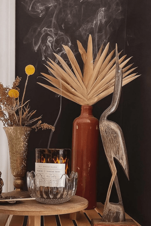 Sherwin williams Tricorn Black on a wall behind eclectic decor.