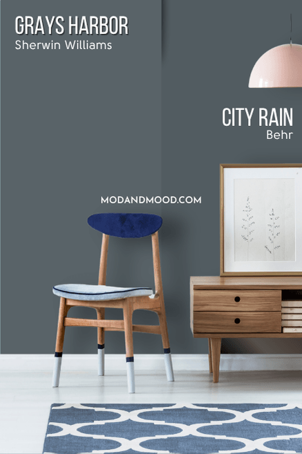 Behr Grays Harbor equivalent City Rain on half of a wall with Grays Harbor on the other half behind a wooden console table and a wooden chair.