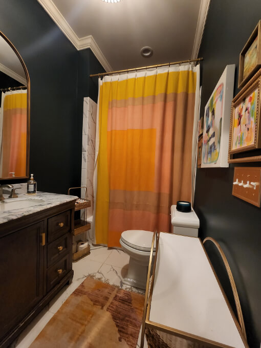Sherwin Williams Ripe Olive on all of the walls in a full bathroom.