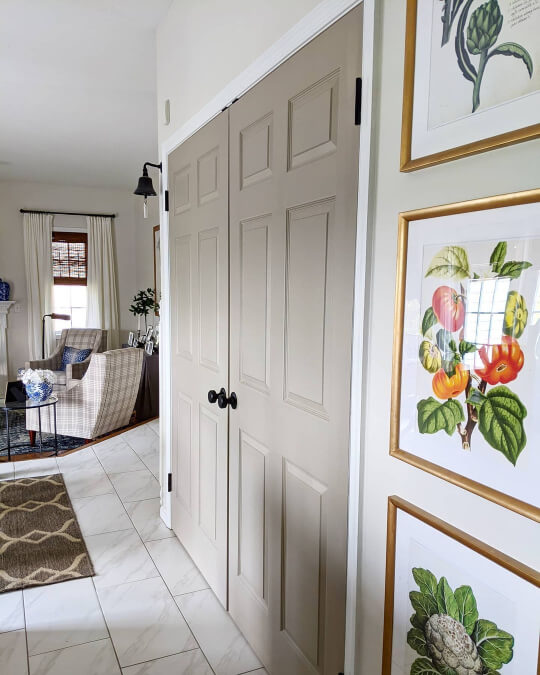Sherwin Williams Shiitake on double doors in a hallway with Benjamin Moore Classic Gray walls and white trim
