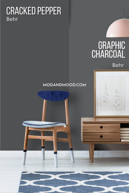 Behr Cracked Pepper on one half of a wall with Graphic Charcoal on the other half behind a wooden chair and a hall table
