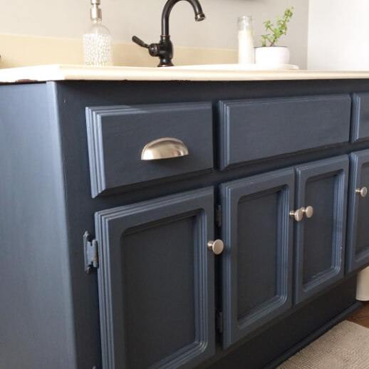 Behr Cracked Pepper on a bathroom vanity with a creamy white countertop.