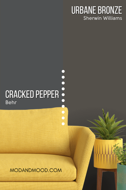 Behr Cracked Pepper on half of a wall and Sherwin Williams Urbane Bronze on the other half behind a mustard sofa.