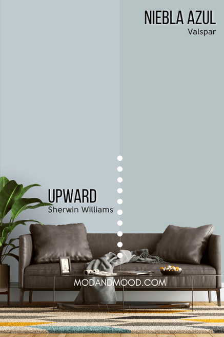 Sherwin Williams Upward on half of a wall and Niebla Azul on the other half behind a gray leather sofa.