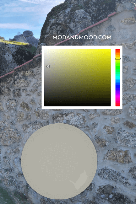 Benjamin Moore Fieldstone paint dot beside hex chart of the same, over a background of a stone cottage.