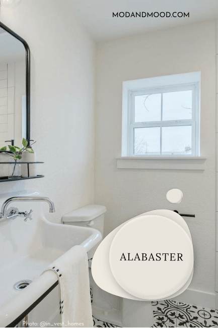 Alabaster in an all white bathroom.