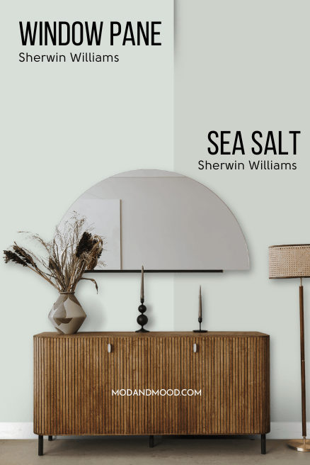 Sherwin Williams Window Pane on half of a wall and Sea Salt on the other half behind a a wood hall table and half moon mirror.