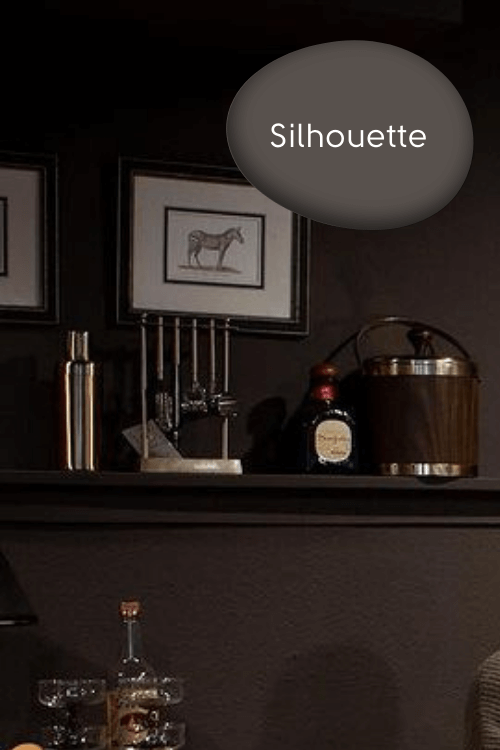 Benjamin moore Silhouette on walls in a flat finish with matching shelves and decor items on them.