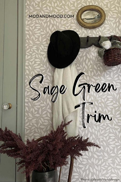 The sage green of fieldstone on trim and doors in a room with neutral leafy wallpap