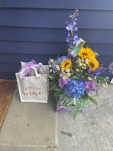 Closeup of Benjamin Moore Deep Royal on siding in a driveway.