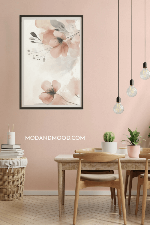 Farrow & Ball Setting Plaster on a dining room wall where it looks quite light. There is a wooden table and chairs, edison bulbs hanging from the ceiling, and a large watercolor flower print on the wall.