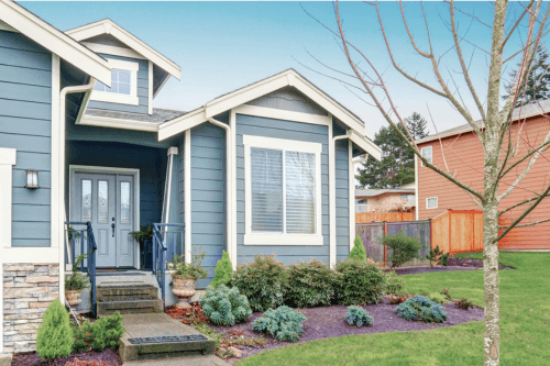 Closer shot of Sherwin Williams Whirlpool on an exterior with creamy white trim and a lighter blue door.