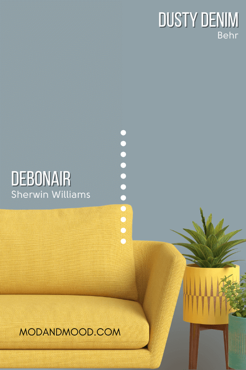 Sherwin Williams Debonair on half of a wall and Behr dupe Dusty Denim on the other half behind a mustard colored sofa and a couple potted plants.