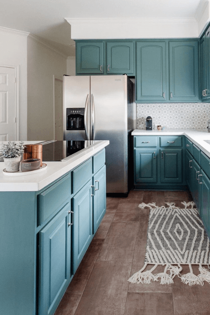 Sherwin Williams Rocky River on kitchen cabinets, a dupe for Behr Hidden Gem in a kitchen with white walls.