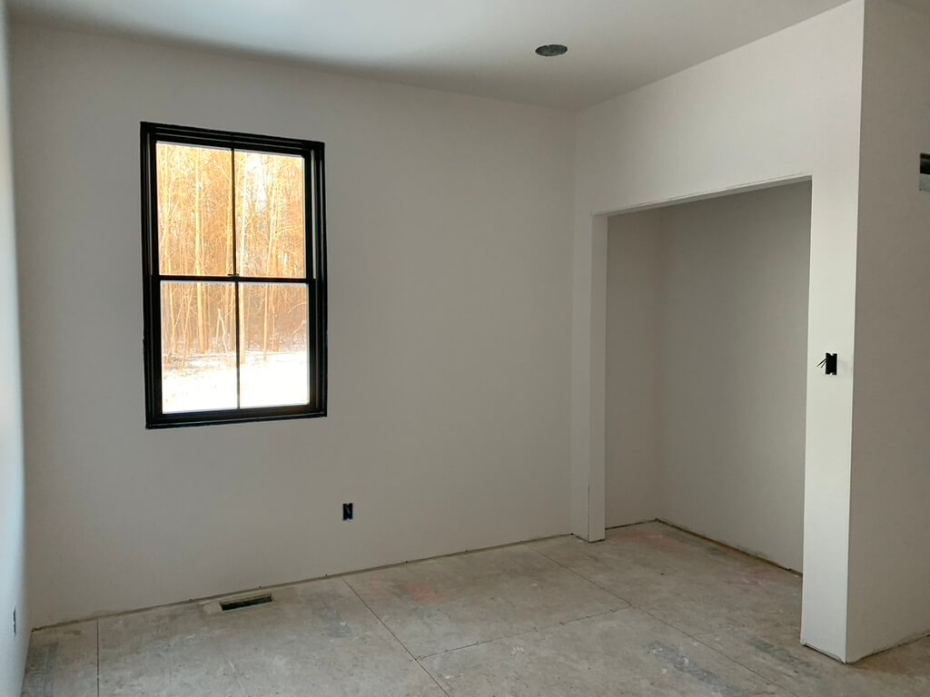 Behr Cameo White in an empty room of a new build