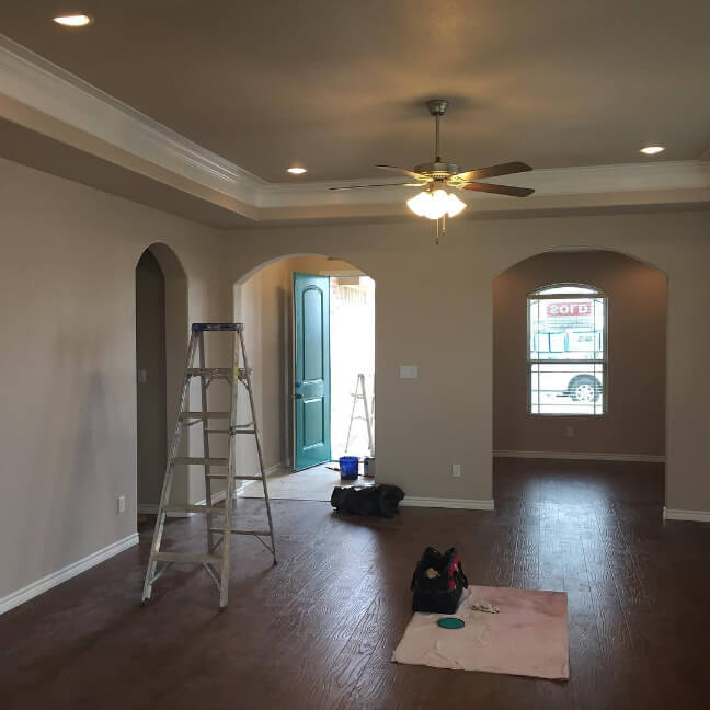Sherwin Williams Simplify Beige on walls and ceiling with white trim.