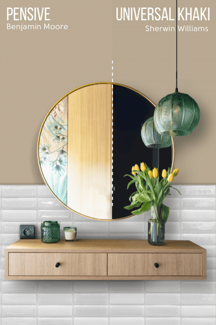 Sherwin Williams Universal Khaki on half of a wall and Benjamin Moore alternative Pensive on the other half behind a round mirror above a wood floating vanity on a white tile lower half of the wall.
