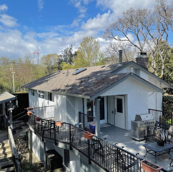 Benjamin Moore Gray Owl on a stucco Exterior with Amherst Gray Trim where it looks lightest.