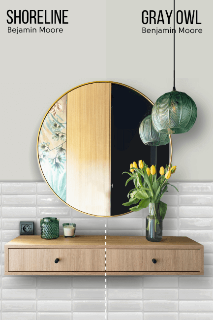 Benjamin Moore Gray Owl on one half of a wall and shoreline on the other half above some white til and a round mirror with a wood vanity.