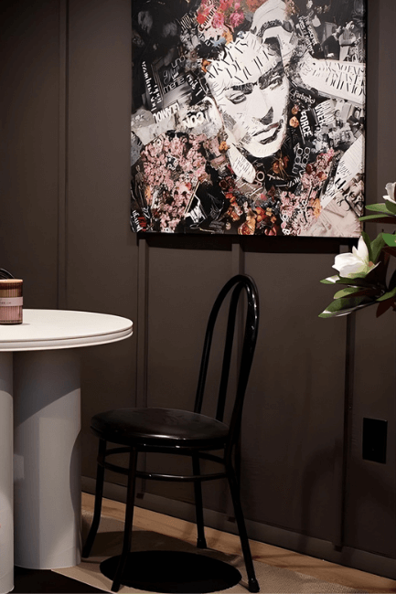 Benjamin Moore Silhouette  color drench in a room with low light and a black chair.