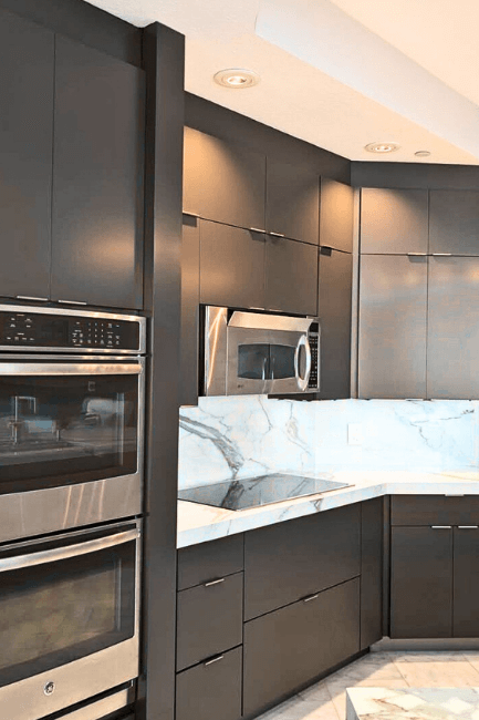 Benjamin Moore Night Horizon on kitchen cabinets where it has been lightened to look like Benjamin Moore Silhouette.