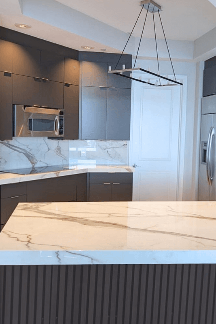 Benjamin Moore Night Horizon on kitchen cabinets where it has been lightened to look like Benjamin Moore Silhouette.