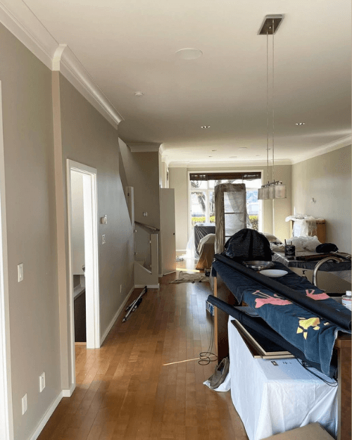 Benjamin Moore Stone Hearth in a long open plan kitchen, dining room, and living room.