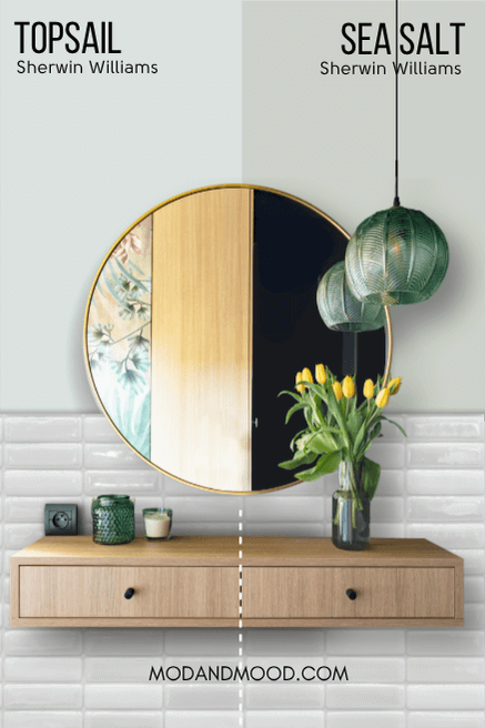 Topsail on half of a wall and sea salt on the other half behind a round mirror and a tiled bathroom wall.