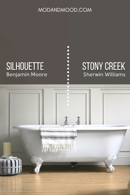 Benjamin Moore Silhouette on half of a wall and Sherwin Williams Stony Creek on the other half above creamy white wainscoting in a bathroom with a clawfoot tub.