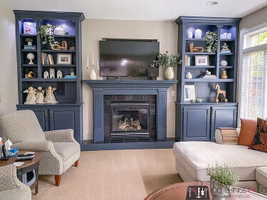 Benjamin Moore Stone Hearth on a wall with Hale Navy bookcases and fireplace.