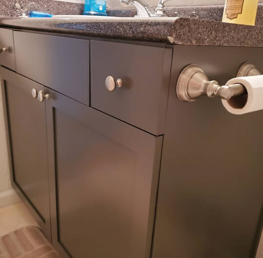 Sherwin Williams Black Fox on a bathroom vanity where it looks dark brown.