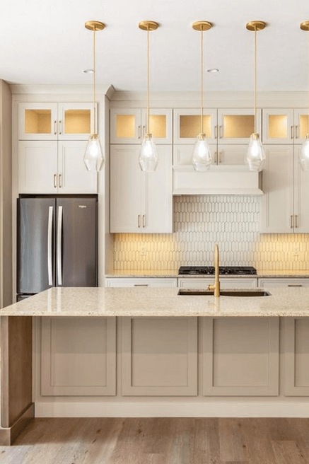 a two toned kitchen with off white wall cabinets and an island in Benjamin Moore Pashmina