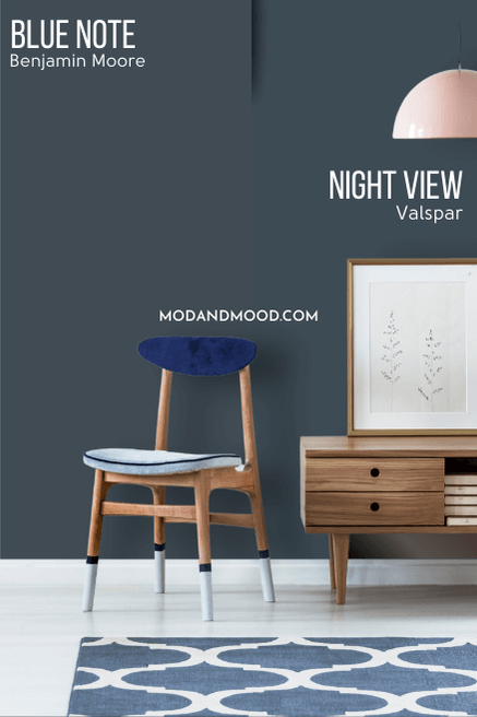 Benjamin Moore Blue Note on half of a wall and Valspar dupe Night View on the other half behind a a wood console table and chair.