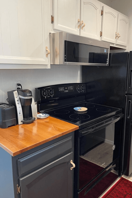 Sherwin Williams Drift of Mist on upper cabinets and Iron Ore on lowers