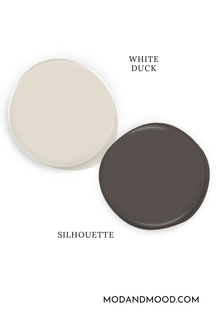 Sherwin Williams White Duck paint dot swatched above a dot of Benjamin Moore Silhouette.