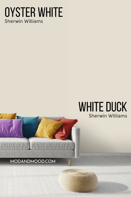 Sherwin Williams Oyster White vs White Duck behind a light gray sofa with jewel toned cushions.