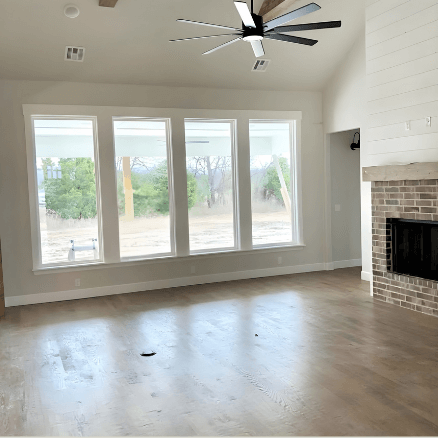 Sherwin Williams Drift of Mist in a large living room with big windows