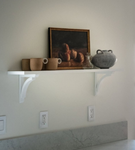 Sherwin Williams White Duck lookalike on walls in a kitchen with a white shelf.