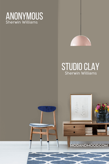 Sherwin Williams Studio Clay on half of a wall and Anonymous on the other half behind a wooden console table and wood chair with a blue seat cushion.