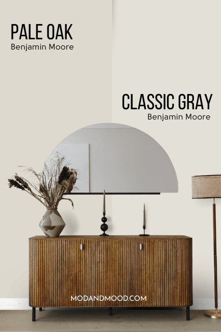 Benjamin Moore Classic Gray on half of a wall and Pale Oak on the other half behind a wood hall table with a half moon mirror