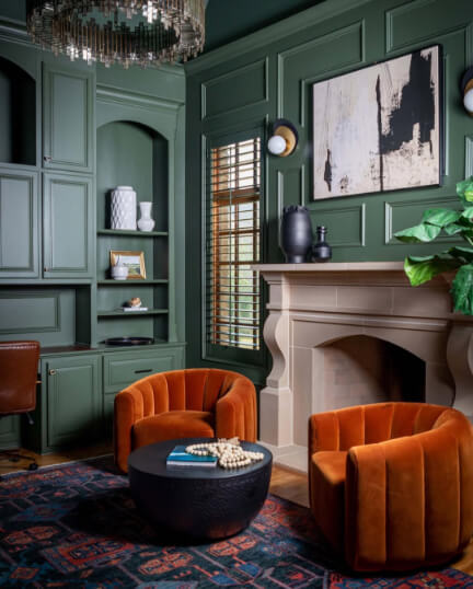 Benjamin Moore Backwoods on woodwork walls in a living room/study.