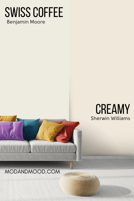 Sherwin Williams Creamy on half of a wall compared to Benjamin moore Swiss Coffee on the other half behind a light gray sofa with jewel toned throw pillows.
