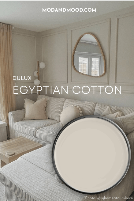 Swatch of Dulux Egyptian Cotton on a paint lid over a background of the color on walls in a living room.