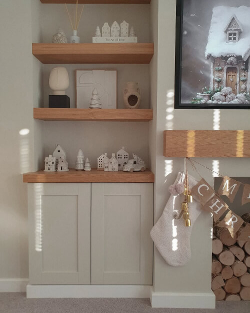 Dulux Egyptian Cotton on built in cabinets in a living room beside a fireplace wall.