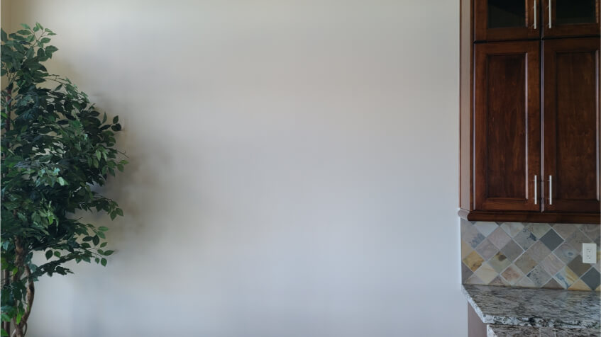 Maritime White looks more gray on a wall with brown cabinets