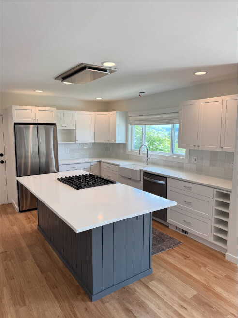 Benjamin Moore Bracken Slate on an island in a white dove kitchen
