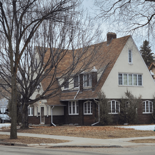 Benjamin Moore Maritime White on a stucco and brick exterior