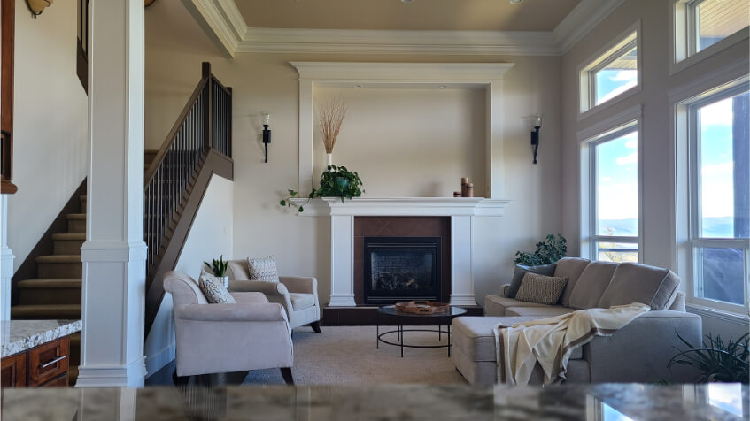 Benjamin Moore Maritime White on walls with steam trim and sea urchin ceiling in an open plan home