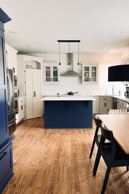 Benjamin Moore Edgecomb Gray and Charcoal Blue in a kitchen with warm wood floors