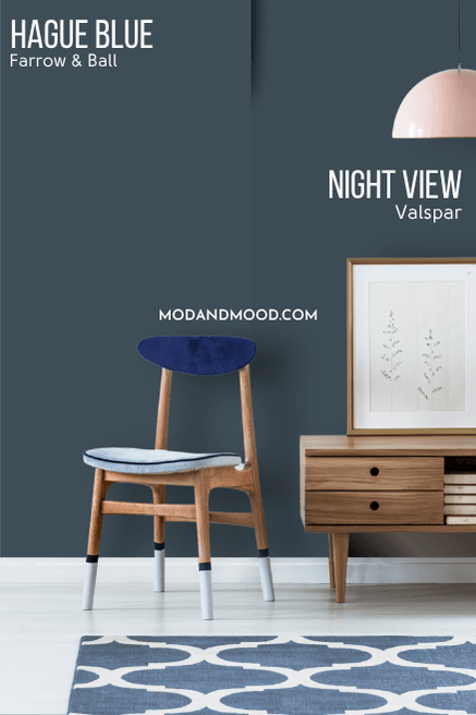 Valspar Night View on half of a wall and Hague Blue on the other half behind a hall table and chair.